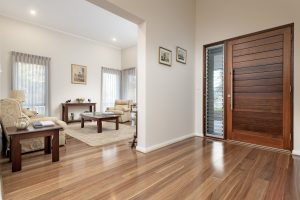 Cedar and louvered entry to this designer home built by devrite multi award winning builder